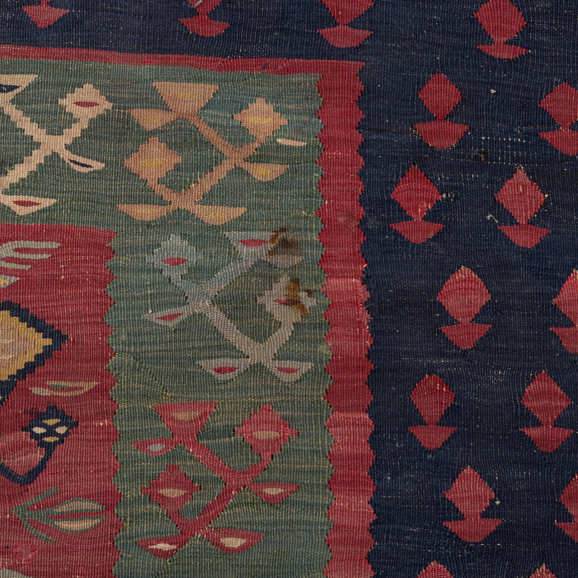 An antique Sarköy kelim, ca 239 x 214 cm.
