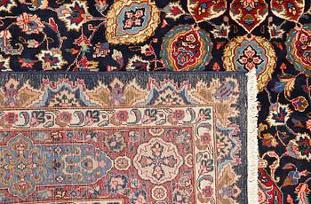 A Kashmar carpet from eastern Iran of 'Ardabil' design, signed, c 338 x 245 cm.