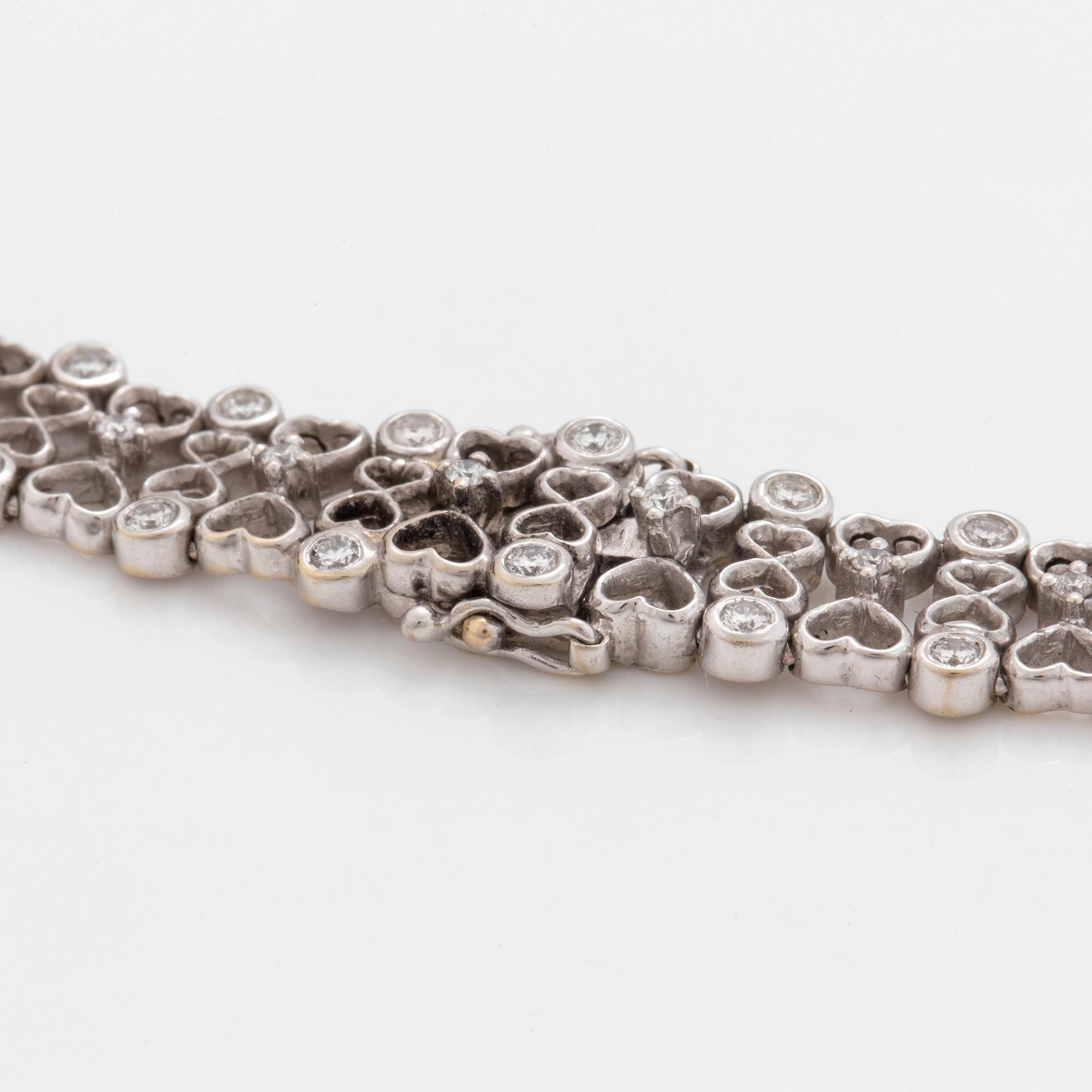 A brilliant cut diamond necklace. Total carat weight of diamonds circa 6.00 cts.