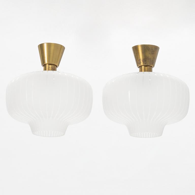 A pair of glass and brass Swedish Modern ceiling lights, Böhlmarks, 1940's.