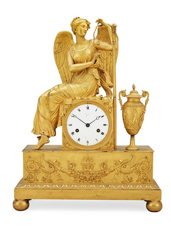 A French Empire early 19th century gilt bronze mantel clock.