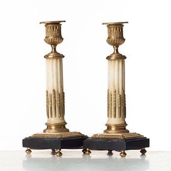 A pair of Louis XVI candlesticks.