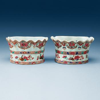 1576. A pair of famille rose wall-tulip vases, Qing dynasty, Qianlong (1736-95).