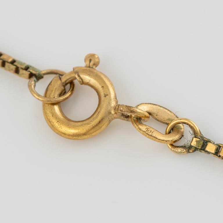 Medallion, 18K gold, onyx, black enamel, and old-cut diamonds, late 19th century.