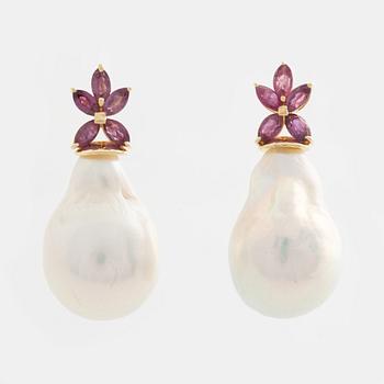 Earrings with cultured baroque freshwater pearls and pink sapphires.