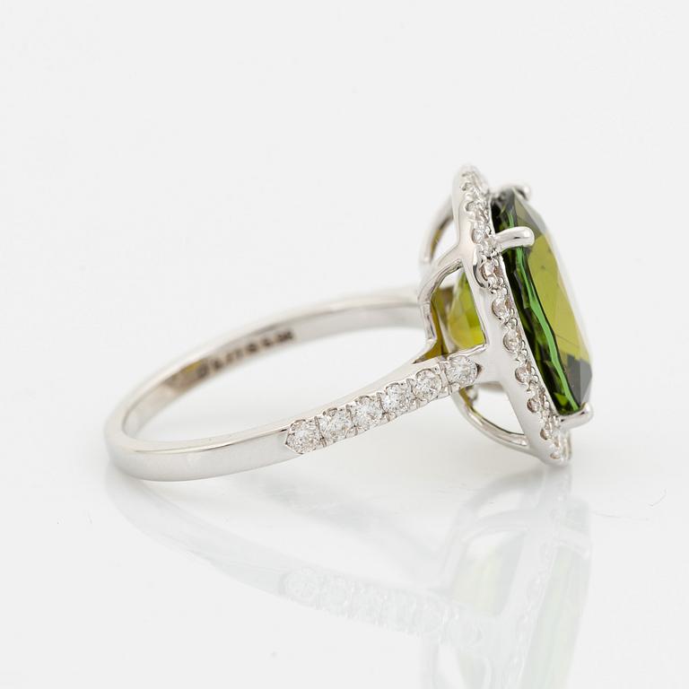 Yellow green tourmaline and brilliant cut diamond cocktail ring.