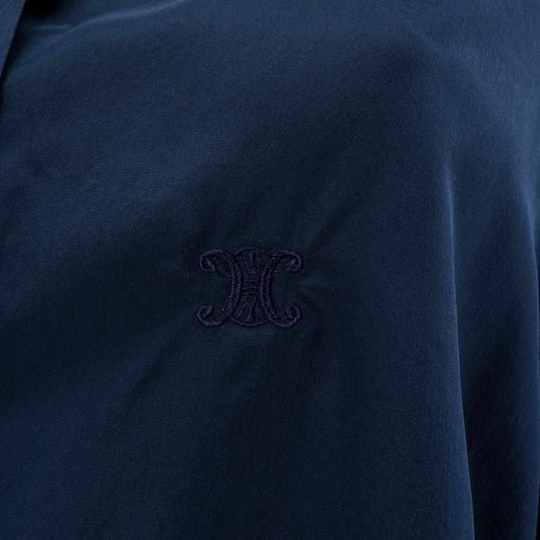 A navyblue silk blouse by Cèline.