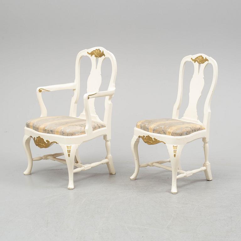 A dining table and six chairs, rococo style, mid 20th century.