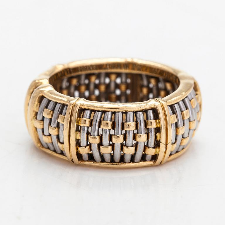 Cartier,an 18K gold and steel ring, with brilliant-cut diamonds.