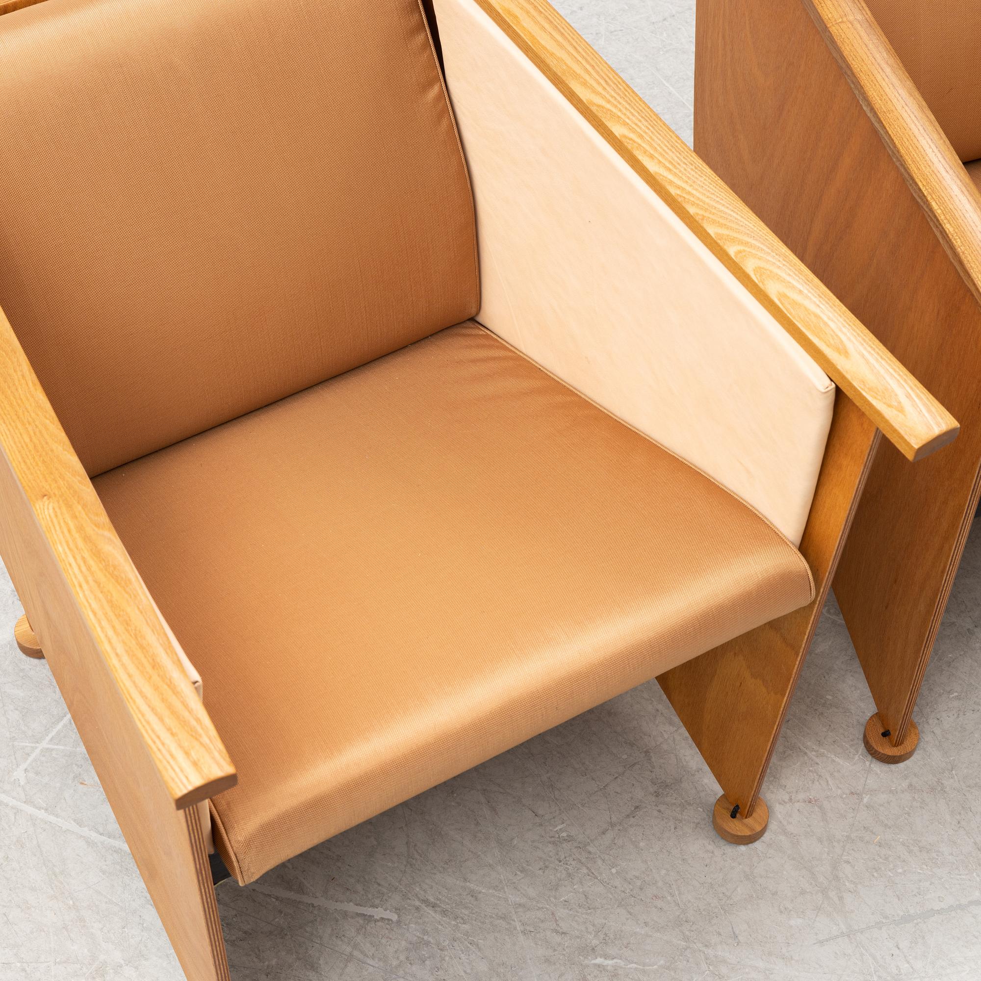 Torbjörn Ahlström, a pair of elm and cherry armchairs.