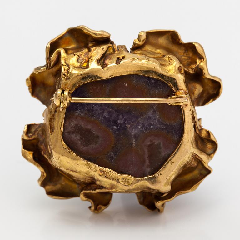 Reino Saastamoinen, An 18K gold and ametyst brooch. Helsinki 1973.