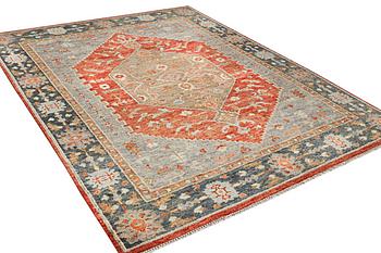 An oriental carpet with Mamluk design, c. 359 x 281 cm.