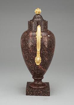 A Swedish Empire 19th Century porphyry and gilt bronze urn.