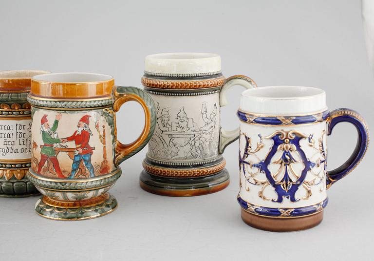 A set of eight majolica mugs from Rörstrand, around the turn of the century 1900.