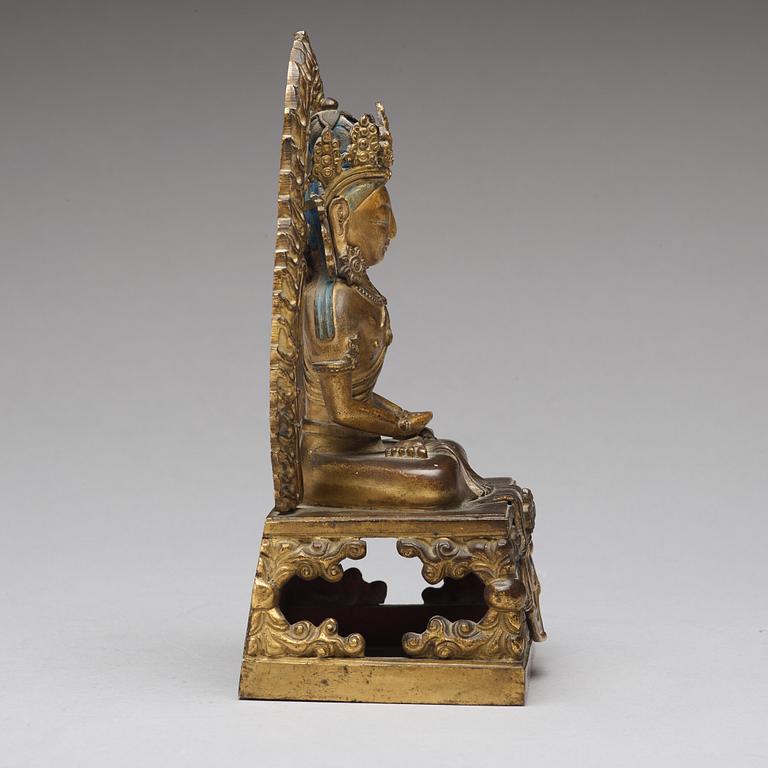 A gilt bronze seated figure of Amitayus, Qing dynasty, Qianlong period, dated by inscription.