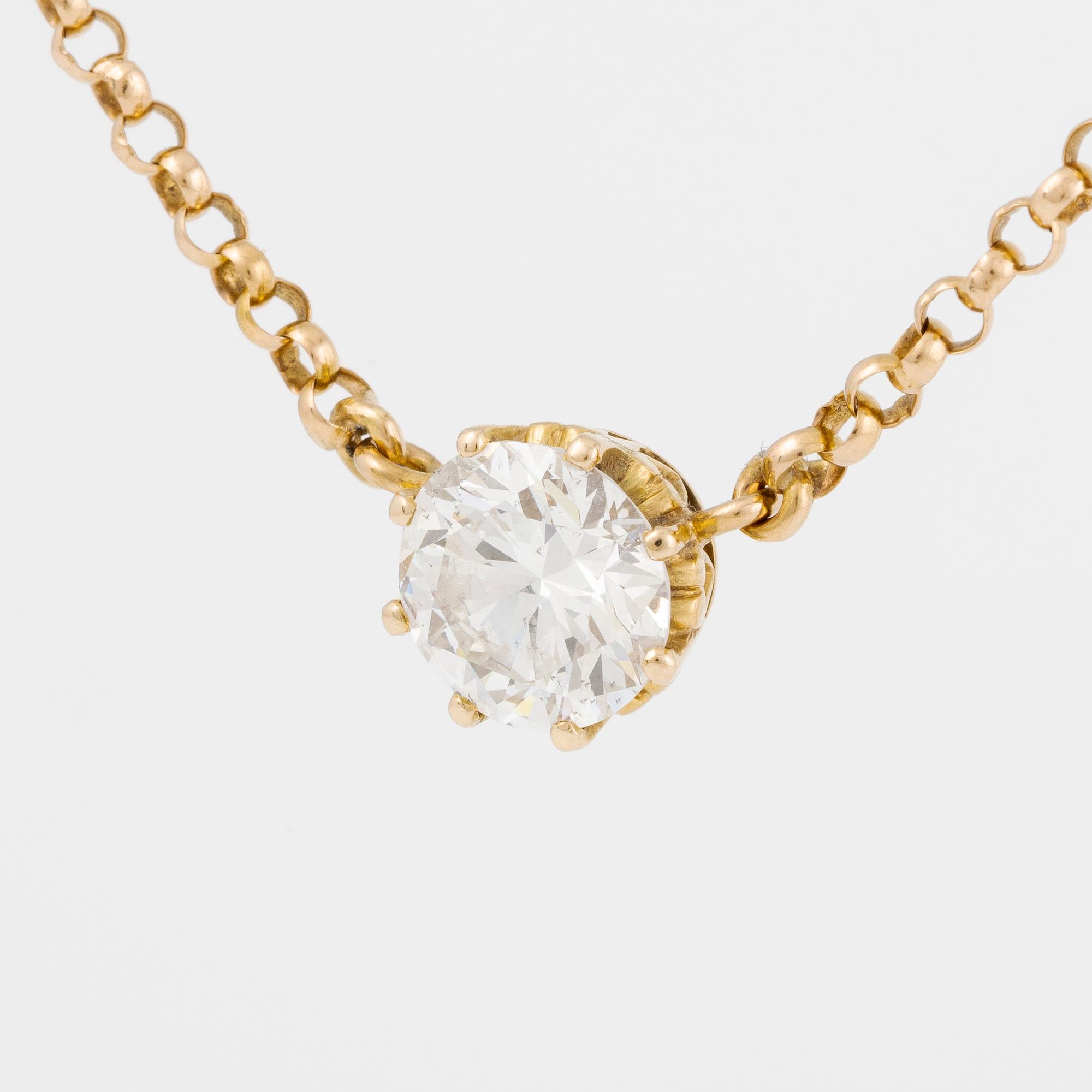 Hängsmycke 18K guld med en rund briljantslipad diamant.
