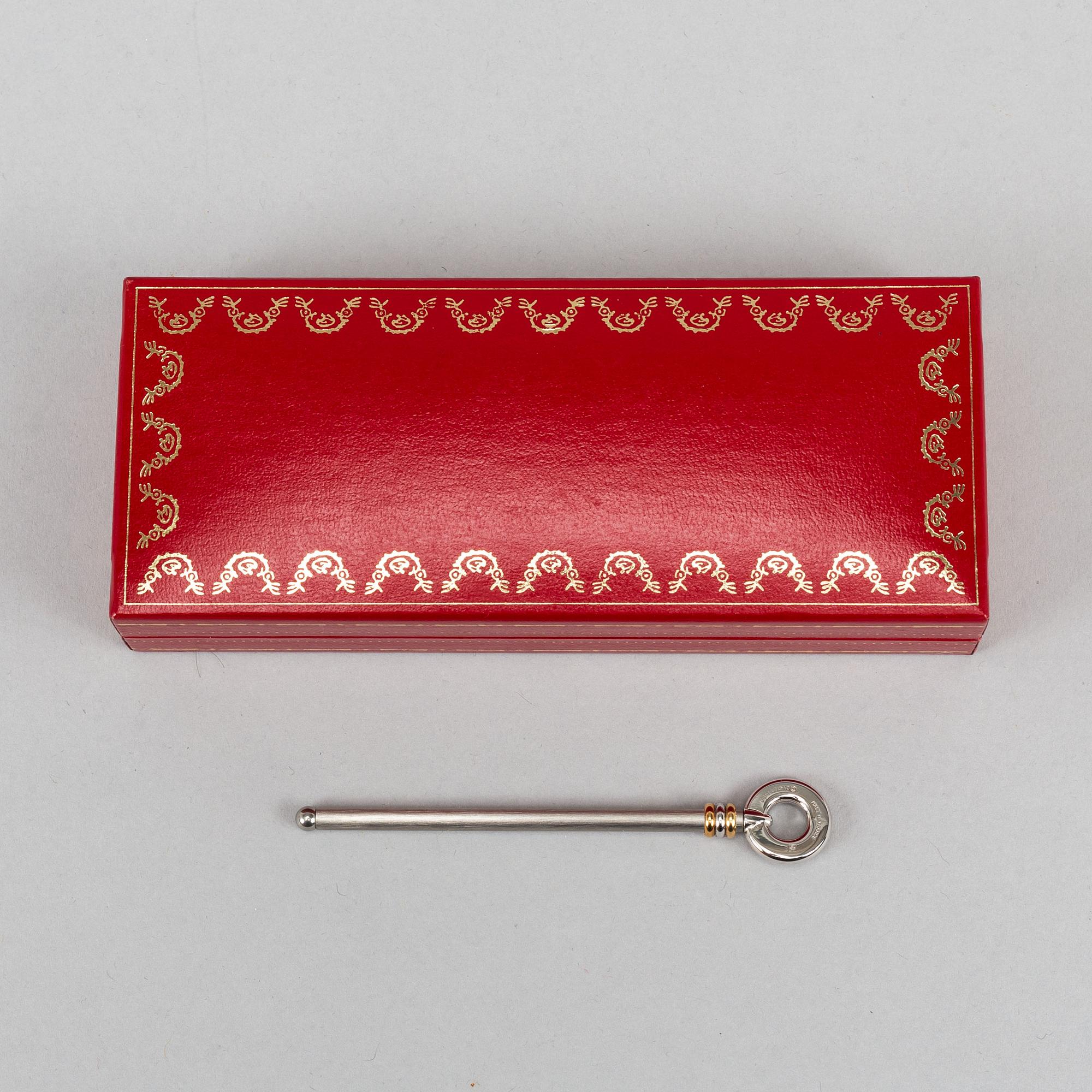 Cartier, jewelery box, key ring and Le must de Cartier champagne swizzle stick.