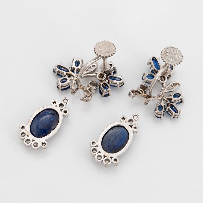 A pair of CF Carlman platinum earrings set with cabochon-cut and faceted sapphires.