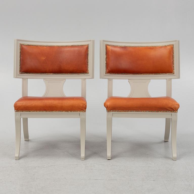 A pair of klismos armchairs, circa 1900.