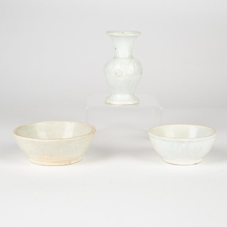 A qingbai vase and two lower parts of boxes, Song dynasty (960-1279).