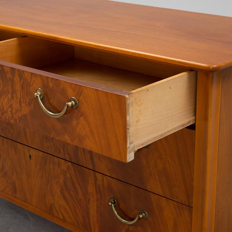 A Swedish Modern mahogany chest of drawers, 1940's/50's.