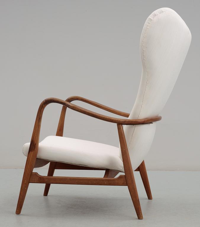 A Danish upholstered wing-back armchair, 1940-50's,