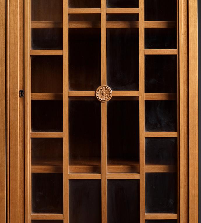 A Swedish Grace mahogany showcase cabinet, reportedly a win at the Stockholm Cabinetmaker's association lottery, 1920's.