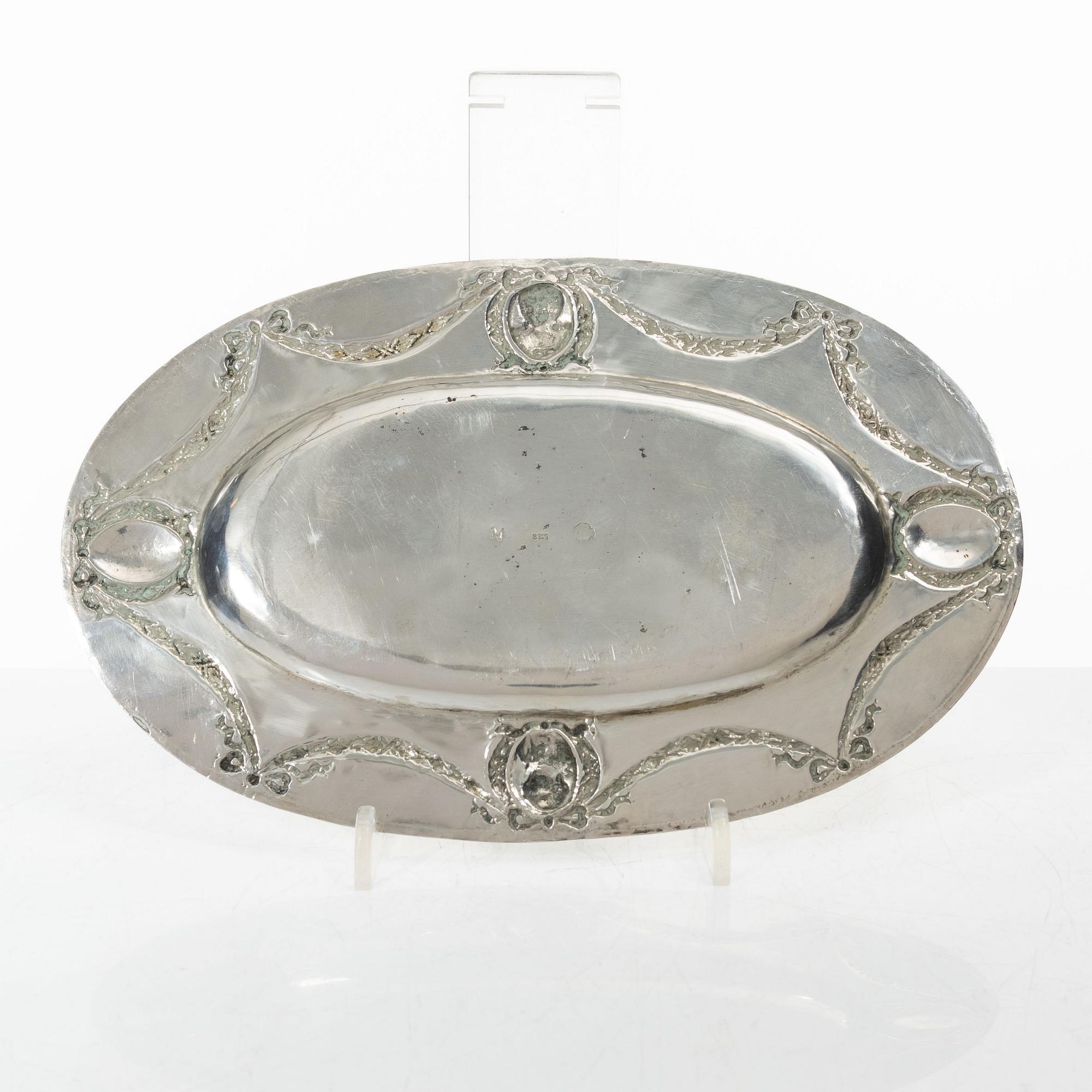 A Rococo style silver sauce boat with dish, 20th Century.