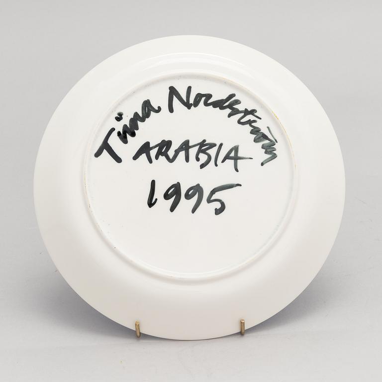 Tiina Nordström, a porcelain decorative plate, signed Tiina Nordström Arabia 1995.