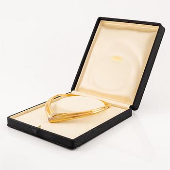 A necklace in 18K gold with round brilliant-cut diamonds.