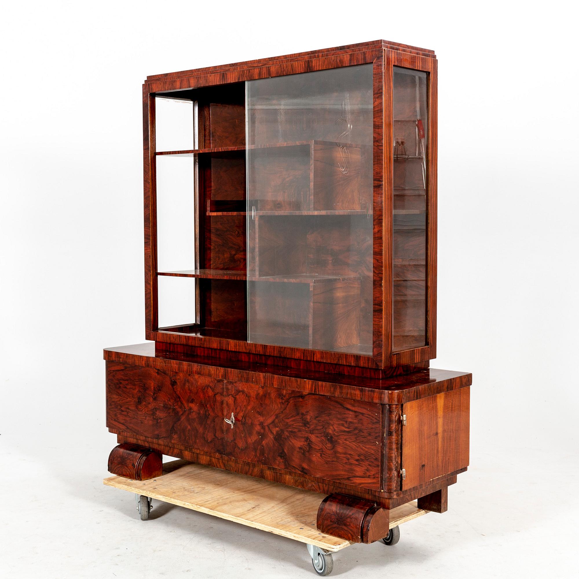 A walnut Art Deco early 1900s display cabinet.
