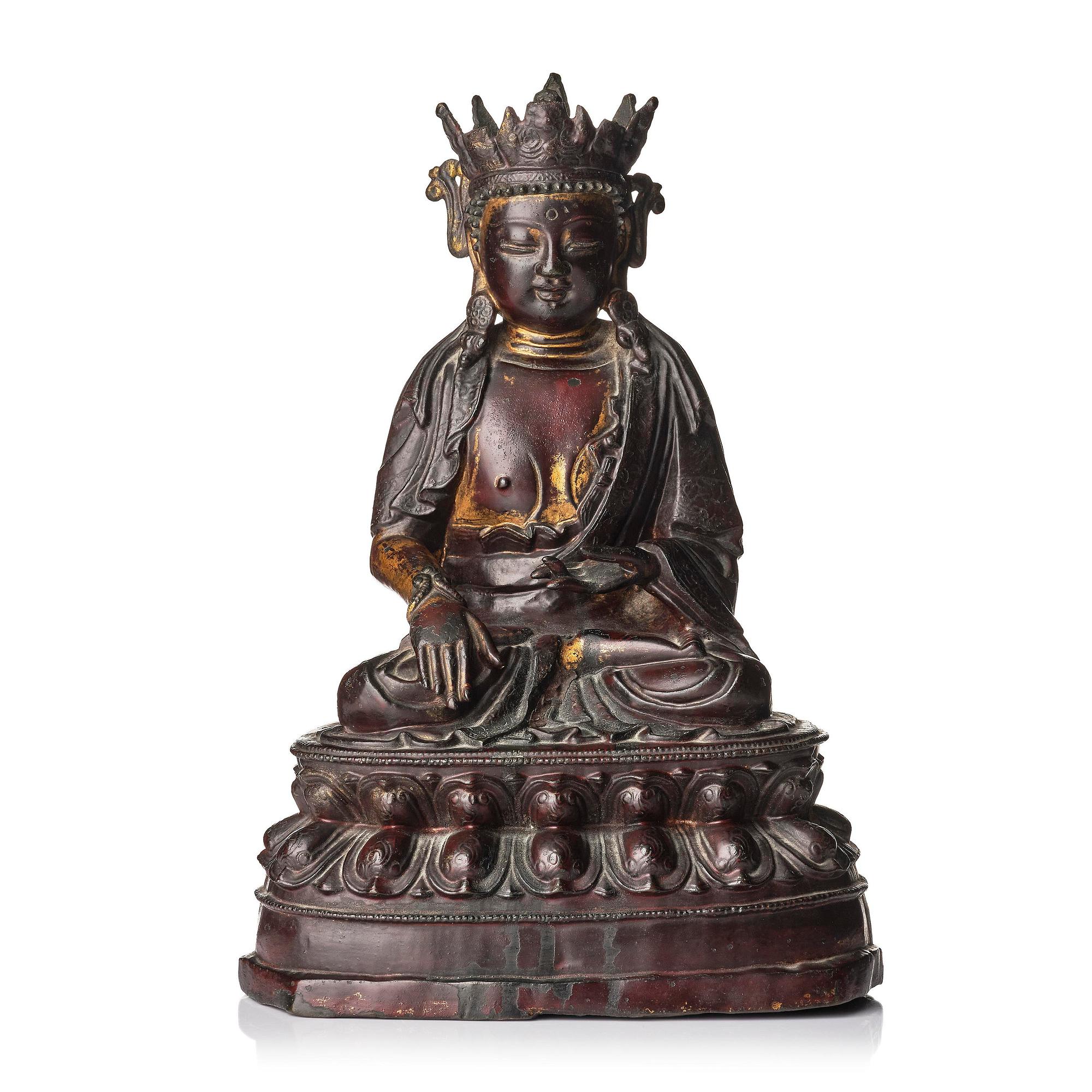 A bronze sculpture of a crowned Buddha, presumably late Ming dynasty, with an inscription dating it as 1530.