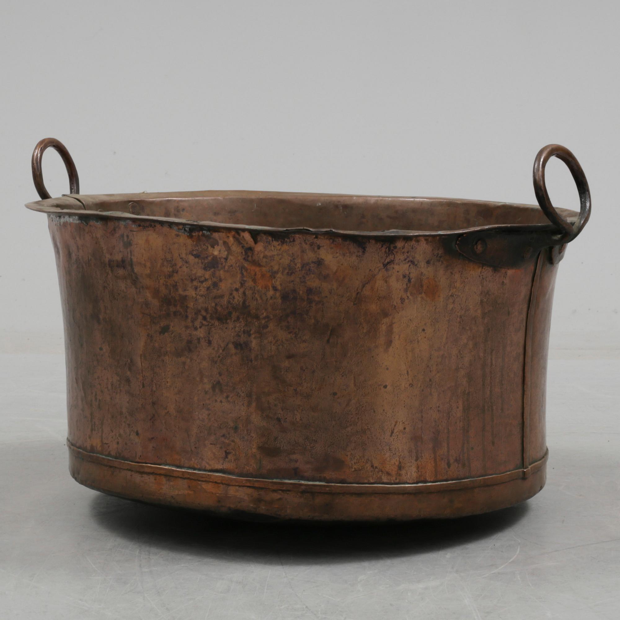 A 19th century copper cauldron.