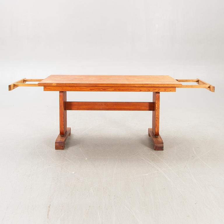 A 1940s pine dining table.