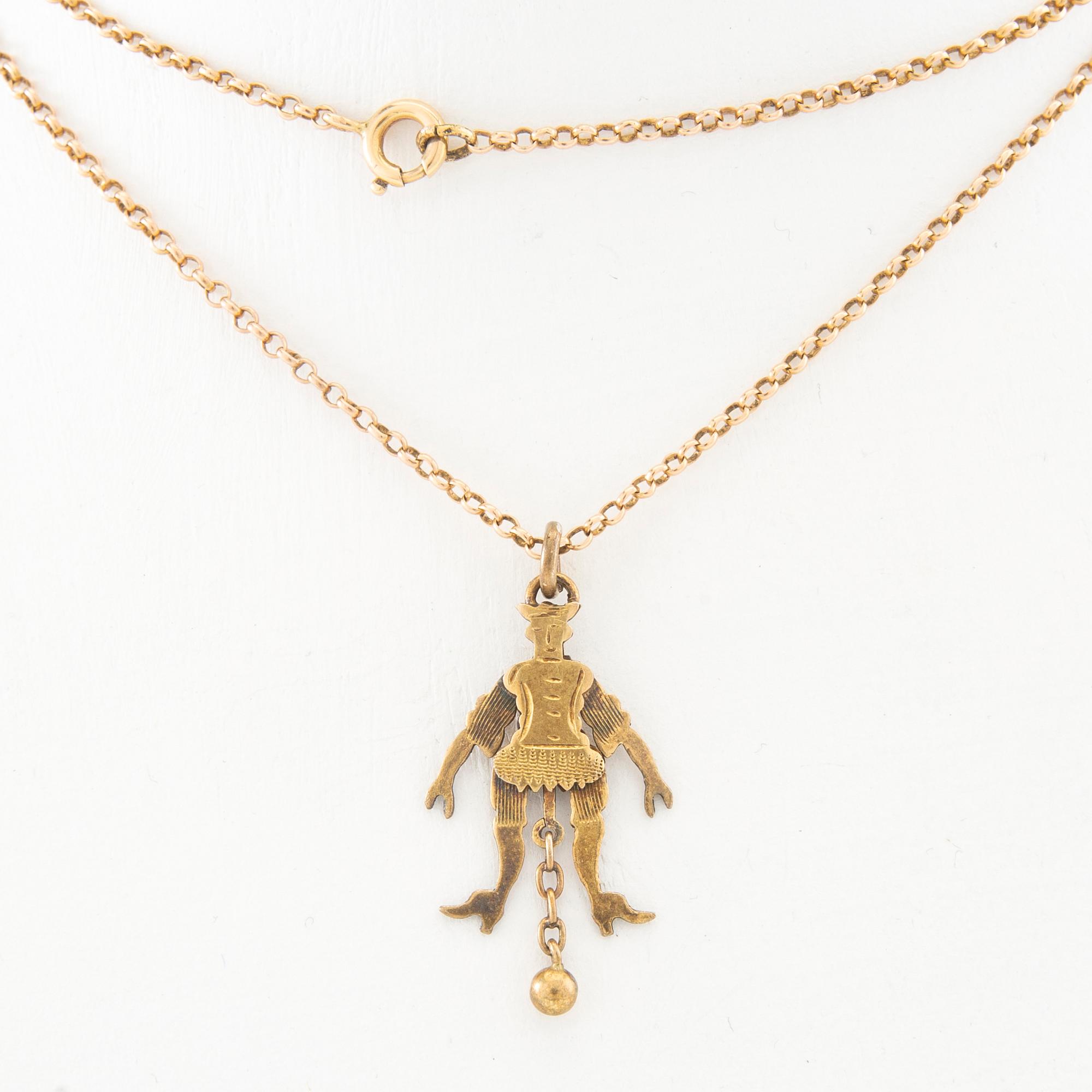 Halsband med kedja av 18K guld, hänge i form av en "sprattelgubbe" av 8K guld.