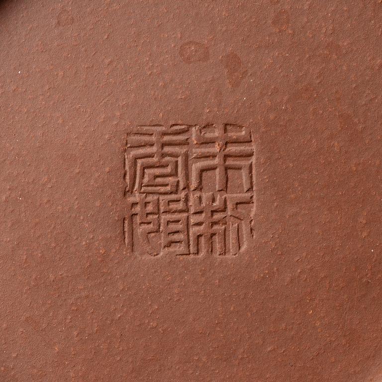 A 'calligraphy' yixing teapot, China, later part of the 1900s.