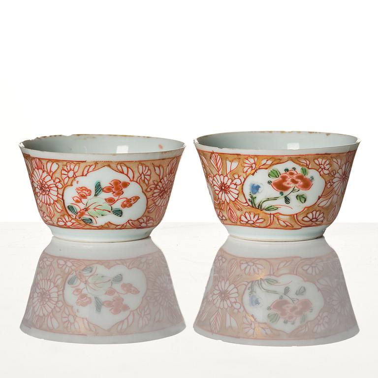 A pair of famille rose miniature cups with stands, Qing dynasty, 18th Century.