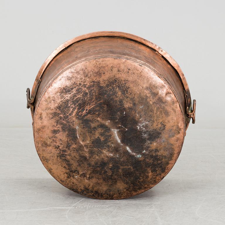 A 19th century copper cauldron.