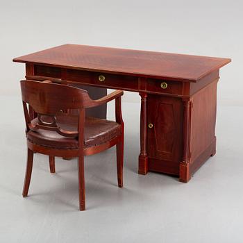 An Empire style writing desk, first half of/mid 20th century, and an Empire style chair, early 20th century.