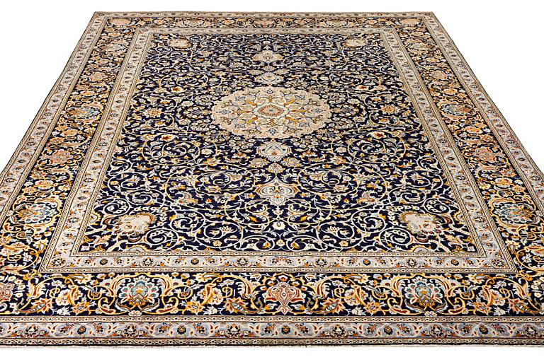 A Kashan carpet, c. 383 x 310 cm.