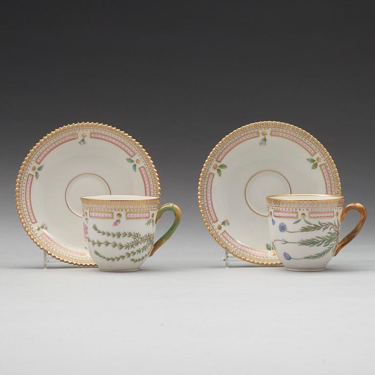 A set of eight cups with stands and six dessert dishes, Royal Copenhagen, 'Flora Danica', 20th Century.