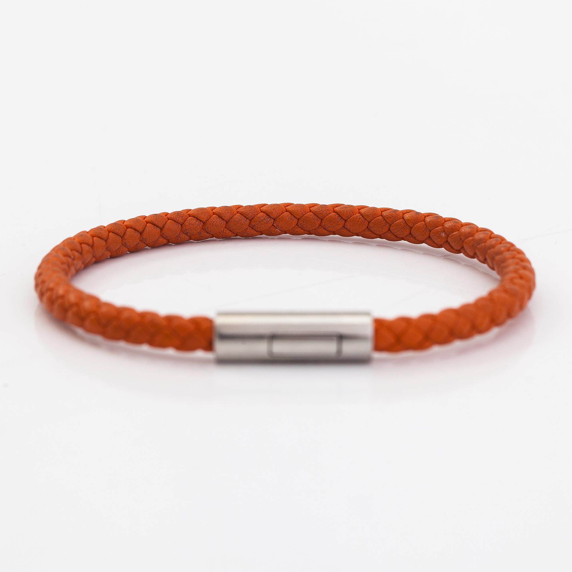 Hermès, A leather and metal bracelet. Marked Hermès Made in Italy.
