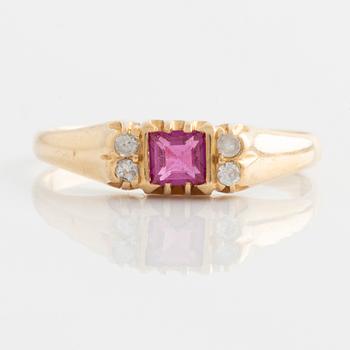 Ring, gold with synthetic pink stone and small white stones.