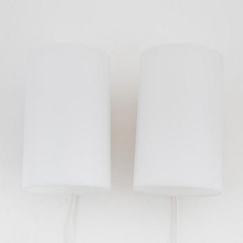 A pair of oak and acrylic wall lights, Luxus, Vittsjö.