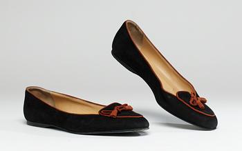 A pair of Hermès shoes.