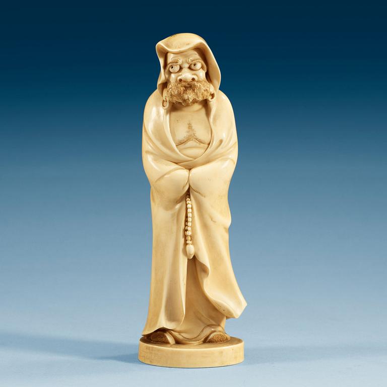 A Japanese ivory figure of a deamon, Meiji period (1868-1912).