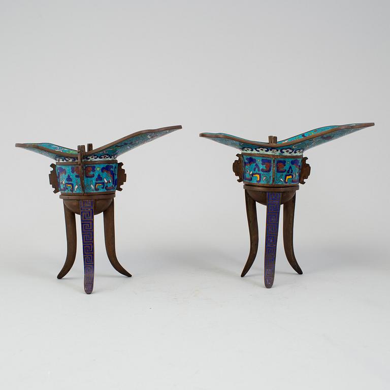 A pair of chinese cloisonné tripod wine vessels, 20th century.