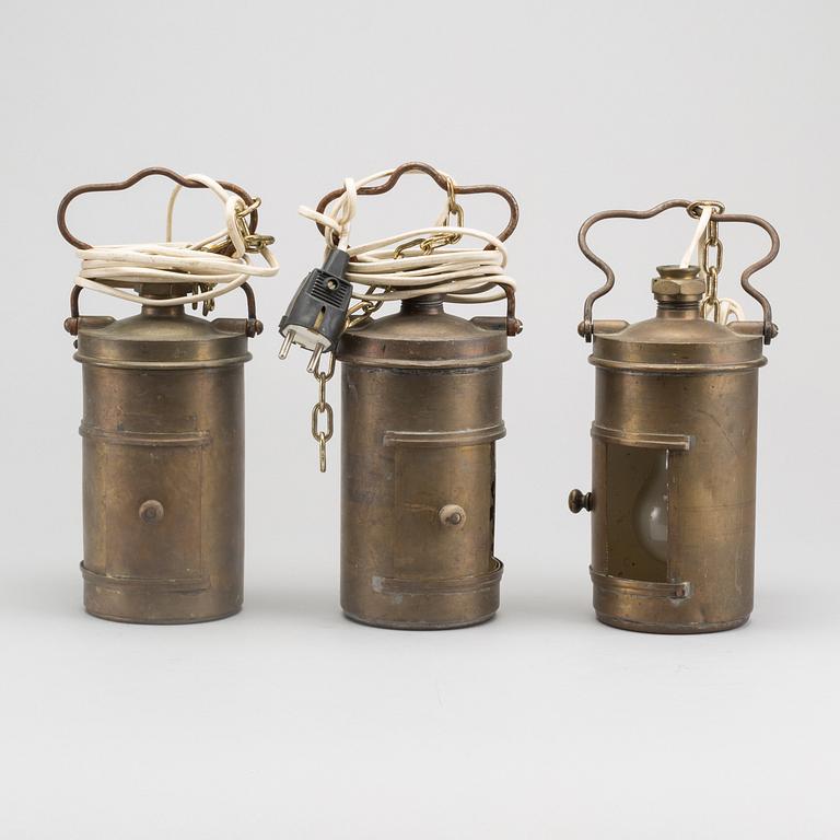 A set of three brass lamps, probably for boats, first half of the 20th century.