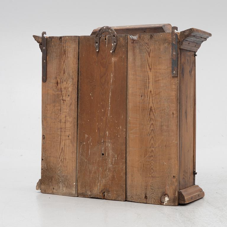 A 18th century wall vitrine cabinet.