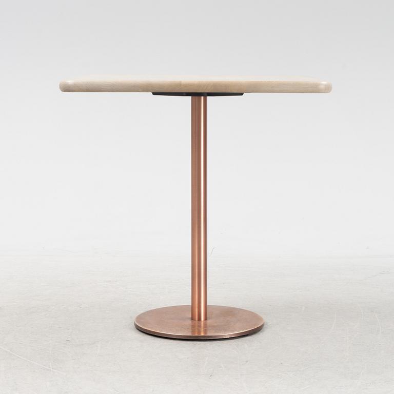 A steel and oak table by Jonas Lindvall 2011.